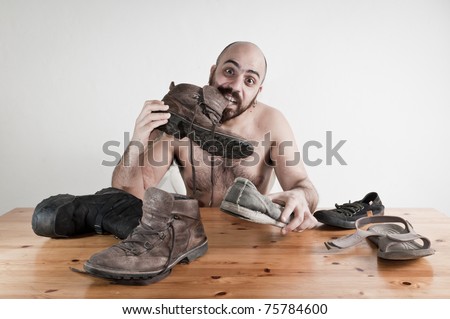 stock-photo-man-eating-shoes-on-the-table-conceptual-75784600.jpg